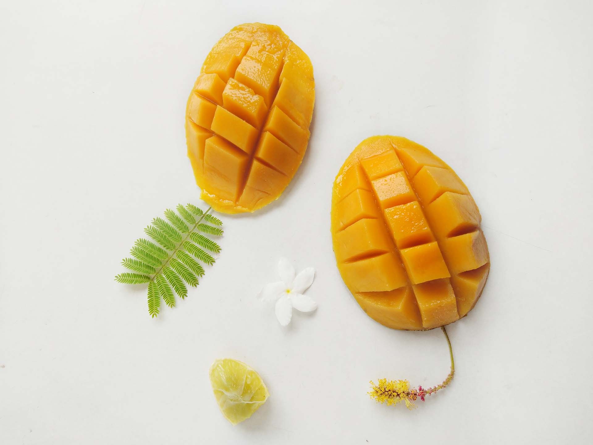Two mango halves cut into cubes